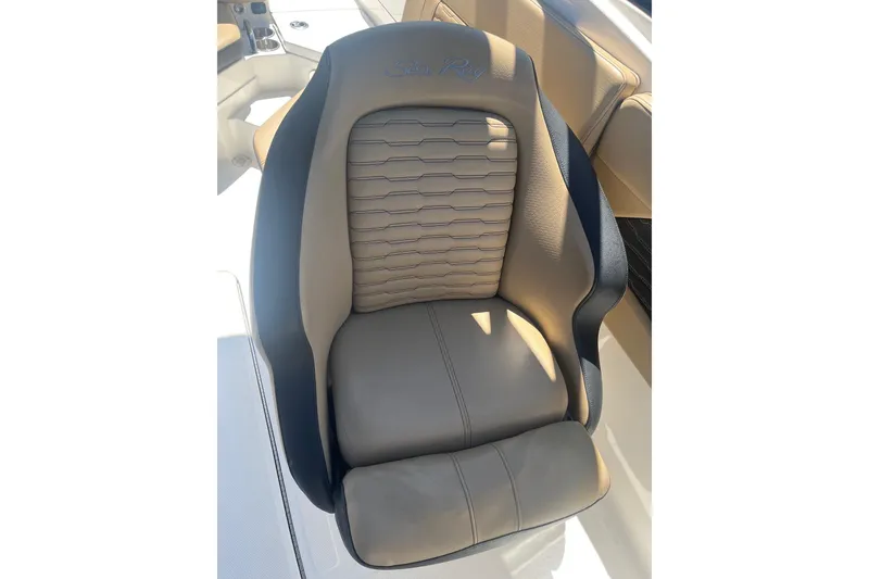 Slide: The Image of 2024 Sea Ray SPX 230 boat seat with elegant beige and black design. - 8