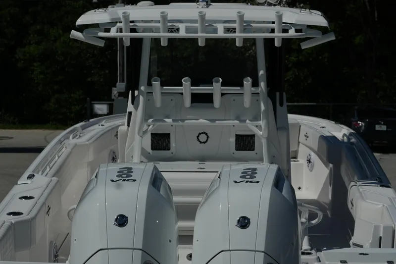 Slide: The Image of 2025 Fountain 32 NX boat with dual V10 engines, sleek design, and spacious deck. - 11