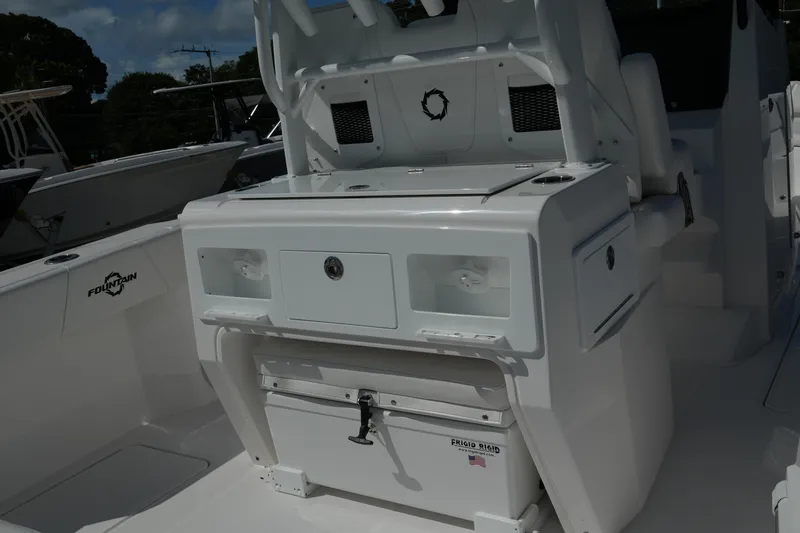 Slide: The Image of 2025 Fountain 32 NX boat interior with storage compartments and seating. - 17