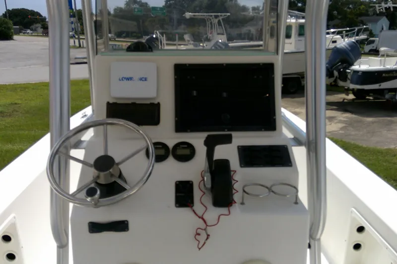 Slide: The Image of 2015 KenCraft 2060 BAYRIDER boat console with steering wheel and controls. - 12