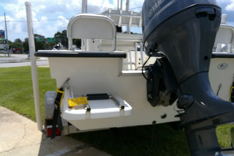 Slide: The Image of 2015 KenCraft 2060 BAYRIDER boat with Yamaha outboard motor, parked on grass. - 19