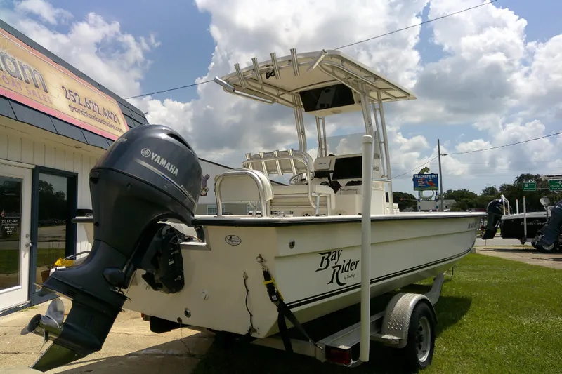 Slide: The Image of 2015 KenCraft 2060 BAYRIDER boat with Yamaha motor on display outside dealership. - 21