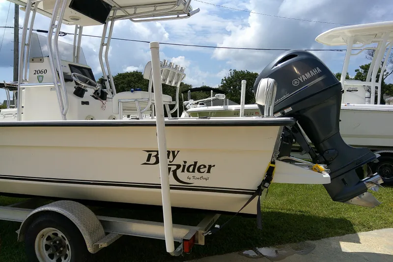 Slide: The Image of 2015 KenCraft 2060 BAYRIDER boat with Yamaha outboard motor on trailer. - 24