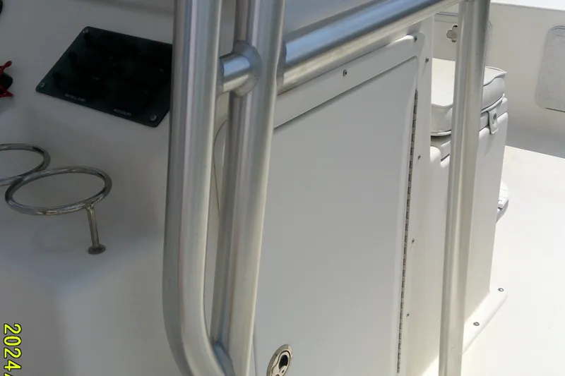 Slide: The Image of 2015 KenCraft 2060 BAYRIDER boat interior with metal railings and control panel. - 5