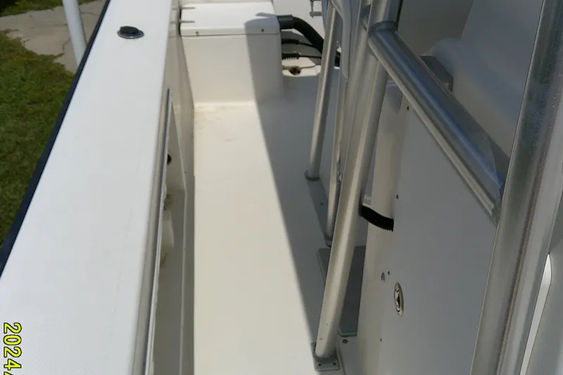 Slide: The Image of 2015 KenCraft 2060 BAYRIDER boat interior with metal railings and clean deck. - 8