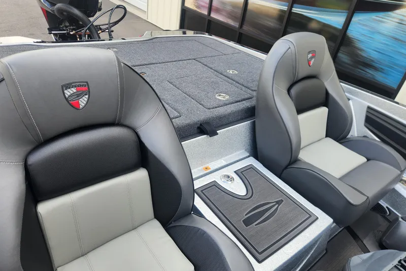 Slide: The Image of 2025 Triton 20XP Patriot boat interior with sleek, comfortable seating and modern design. - 12