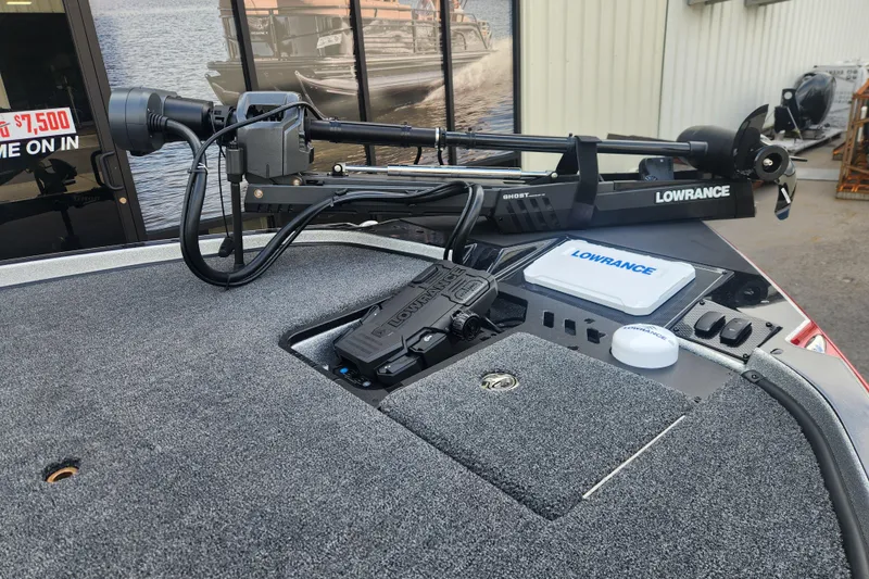 Slide: The Image of Triton 20XP Patriot 2025 boat with Lowrance equipment and trolling motor on deck. - 8