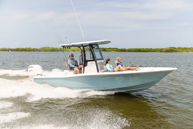 Slide: The Image of 2026 Sea Hunt BX 25 FS boat cruising with passengers on a sunny day. - 7