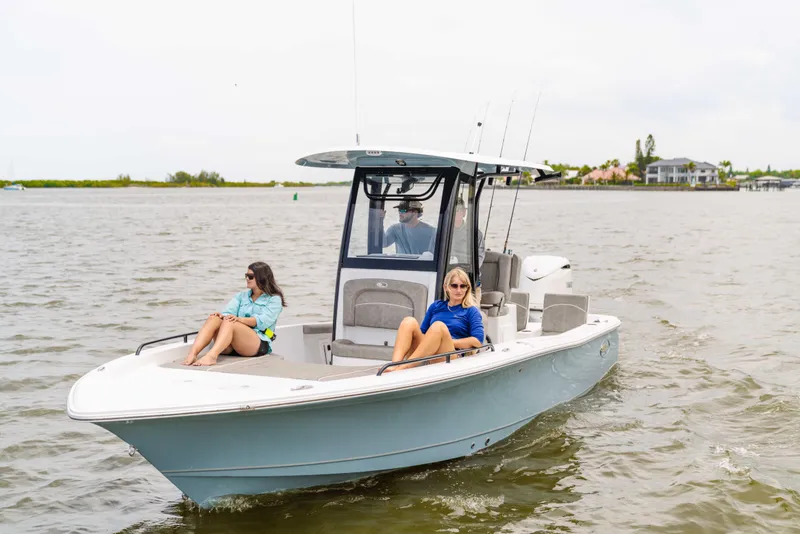 Slide: The Image of 2026 Sea Hunt BX 25 FS boat cruising with passengers on a calm waterway. - 8