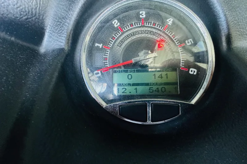 Slide: The Image of Close-up of 2014 Axis A24 dashboard gauge displaying RPM and engine hours. - 19