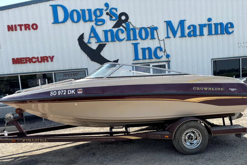 The Image of 2001 Crownline 18' boat on trailer outside Doug's Anchor Marine Inc. - 0
