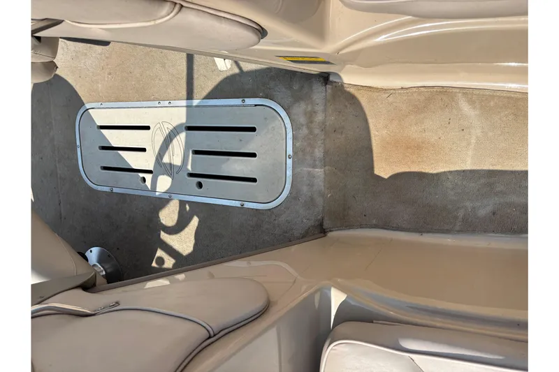 Slide: The Image of Interior of a 2001 Crownline 18' boat showing seating and flooring details. - 9