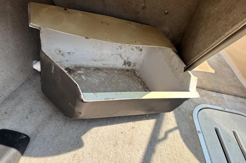 Slide: The Image of Old storage compartment in 2001 Crownline 18' boat interior. - 19