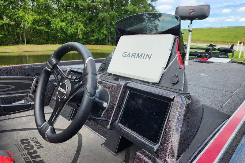 Slide: The Image of 2025 Triton 21XP Patriot boat dashboard with Garmin navigation system. - 8