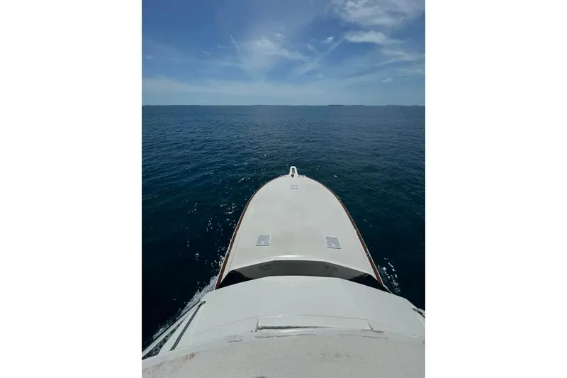 Slide: The Image of Luxurious master stateroom with elegant bedding and decor. Storage under bed, - 11