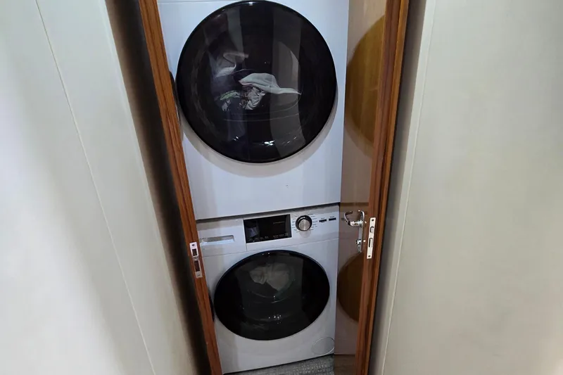 Slide: The Image of Port side bridge seating with gaff and rod storage underneath - 27