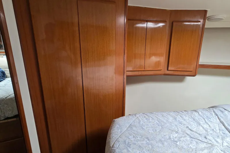 Slide: The Image of Luxury seating on 1998 Viking 58 Convertible yacht with wooden deck. - 35