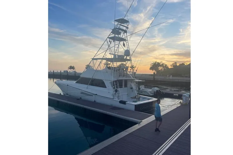 Slide: The Image of Luxurious and spacious interior of a 1998 Viking 58 Convertible yacht with modern amenities and cozy seating. - 6