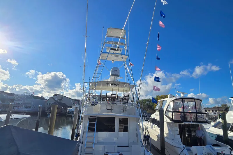 Slide: The Image of Luxurious kitchen interior of 1998 Viking 58 Convertible yacht with wooden cabinets and modern lighting. - 9