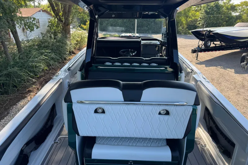 Slide: The Image of 2024 Nor-Tech 400 Supersport boat with sleek design and luxurious seating. - 15