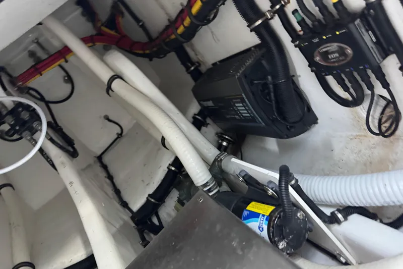 Slide: The Image of 2024 Nor-Tech 400 Supersport boat on trailer, parked outdoors, under clear blue sky. - 24