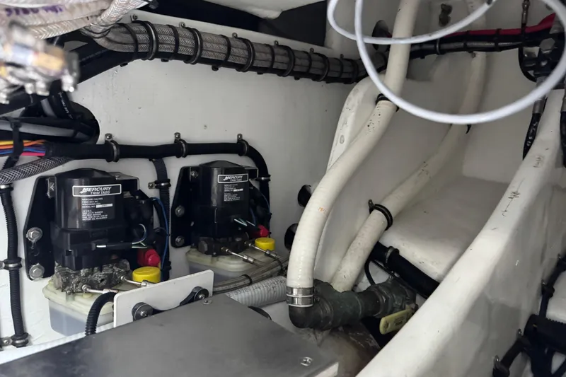 Slide: The Image of 2024 Nor-Tech 400 Supersport boat on trailer, featuring powerful outboard engines. - 25