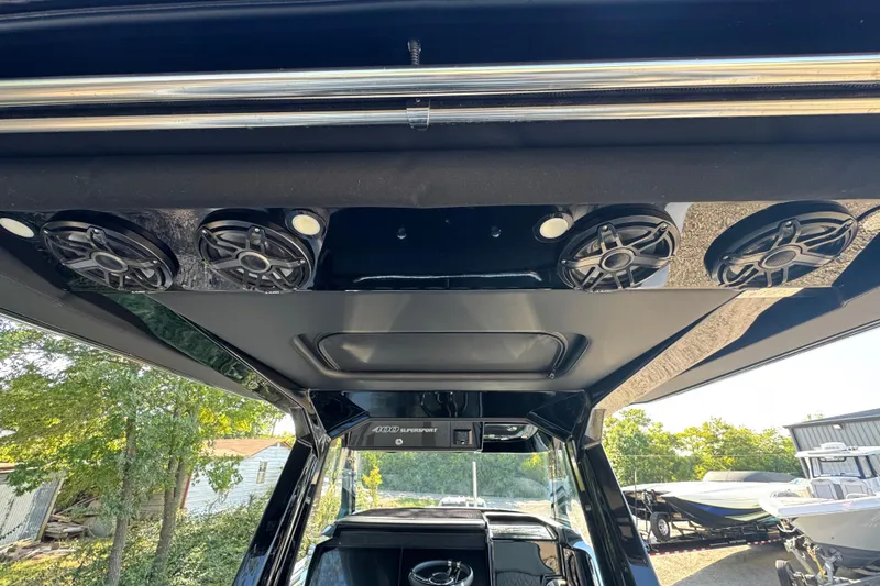 Slide: The Image of 2024 Nor-Tech 400 Supersport boat interior with advanced navigation system and sleek design. - 30