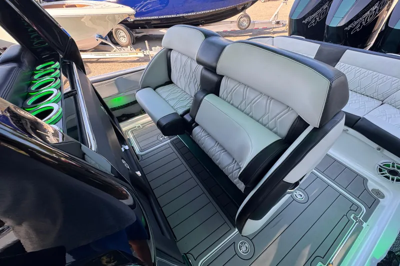 Slide: The Image of 2024 Nor-Tech 400 Supersport boat on trailer, parked outdoors. - 36