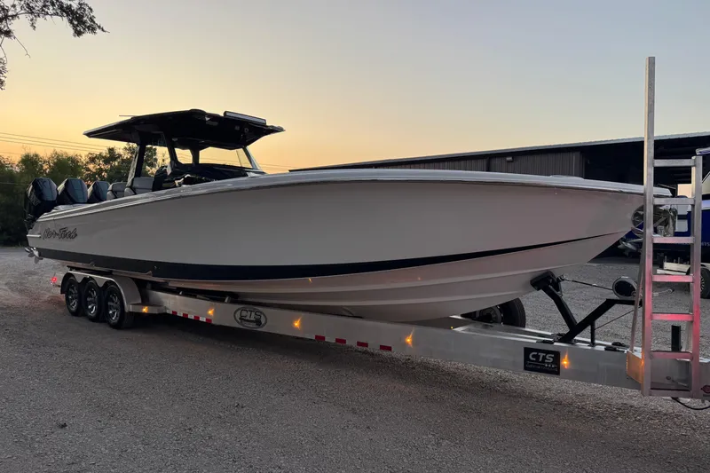 Slide: The Image of 2024 Nor-Tech 400 Supersport boat interior with modern dashboard and seating. - 5