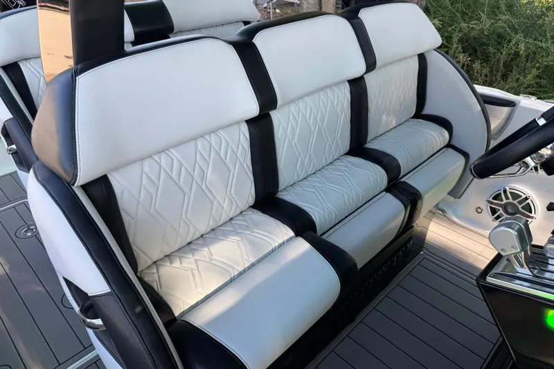 Slide: The Image of Interior of 2024 Nor-Tech 400 Supersport with communication device and branded bag. - 68