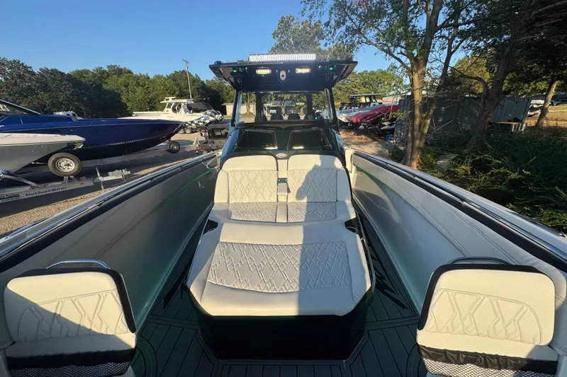 Slide: The Image of 2024 Nor-Tech 400 Supersport with four powerful outboard engines, rear view. - 76