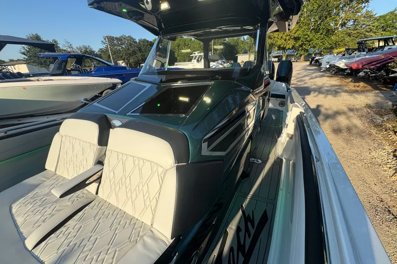 Slide: The Image of 2024 Nor-Tech 400 Supersport boat with four powerful outboard engines. - 79