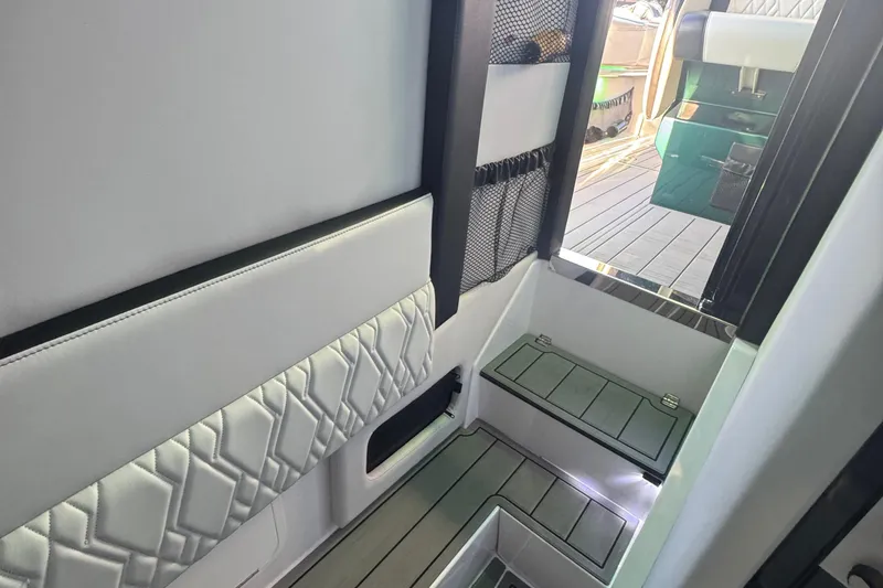 Slide: The Image of Interior view of 2024 Nor-Tech 400 Supersport boat storage compartment. - 87