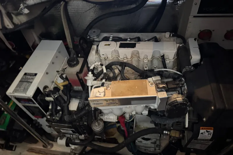 Slide: The Image of Engine room of 2008 Cruisers Yachts 395 Motoryacht, showcasing mechanical components and wiring. - 61
