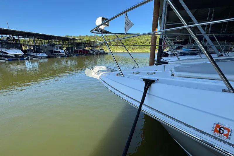 Slide: The Image of 2008 Cruisers Yachts 395 Motoryacht docked at marina, calm water, clear sky. - 10