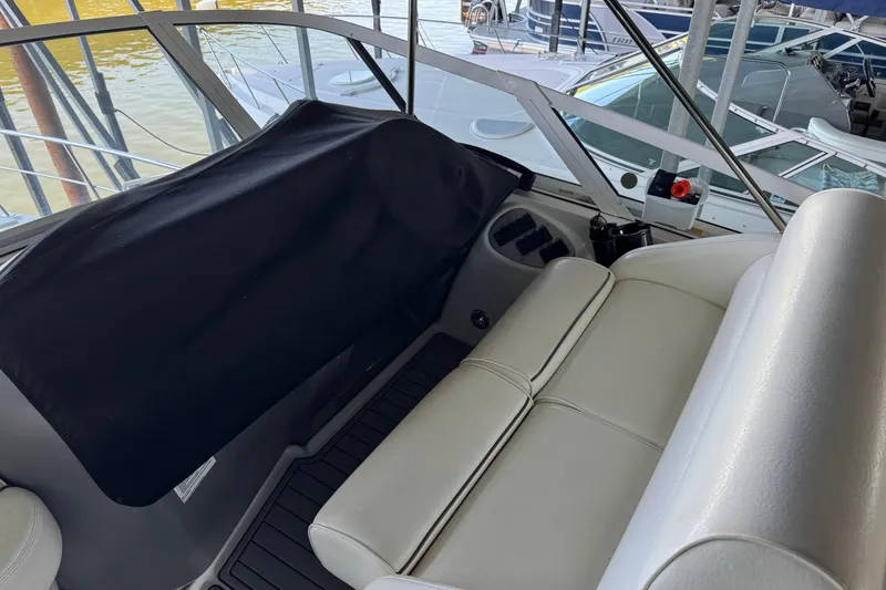 Slide: The Image of 2008 Cruisers Yachts 395 Motoryacht interior with white seating and covered dashboard. - 31