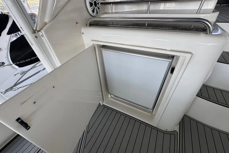 Slide: The Image of 2008 Cruisers Yachts 395 Motoryacht interior with open storage compartment and speaker. - 14