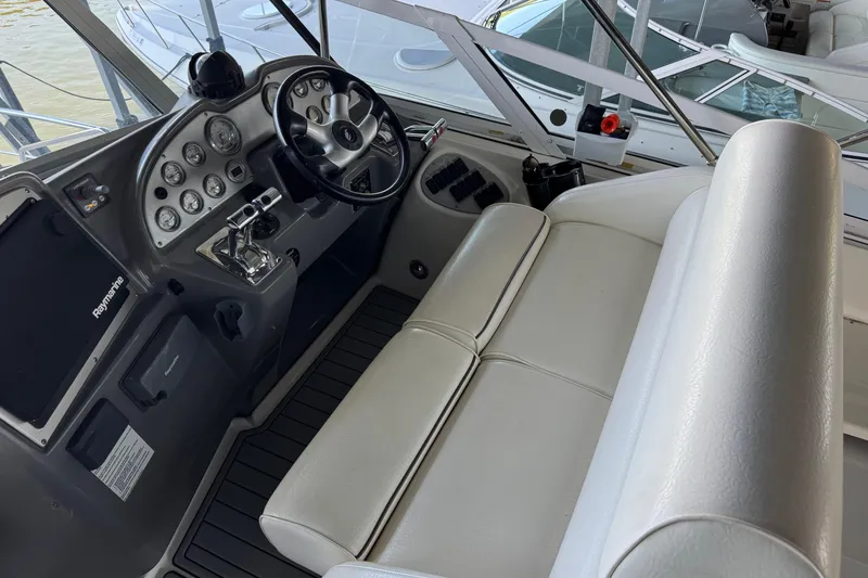 Slide: The Image of 2008 Cruisers Yachts 395 Motoryacht helm with steering wheel and control panel. - 16