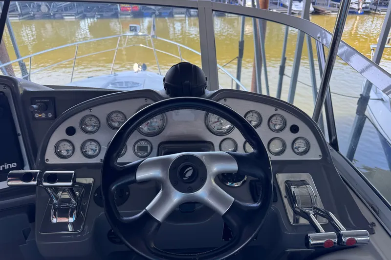 Slide: The Image of Helm of 2008 Cruisers Yachts 395 Motoryacht with steering wheel and control panel. - 17