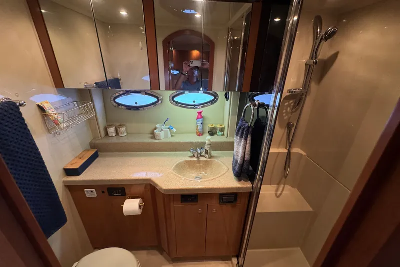 Slide: The Image of Luxurious bathroom in 2008 Cruisers Yachts 395 Motoryacht with modern fixtures and elegant design. - 58