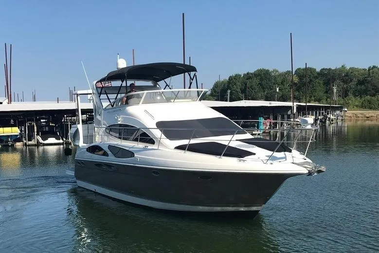 Slide: The Image of 2008 Cruisers Yachts 395 Motoryacht on calm water near marina. - 3