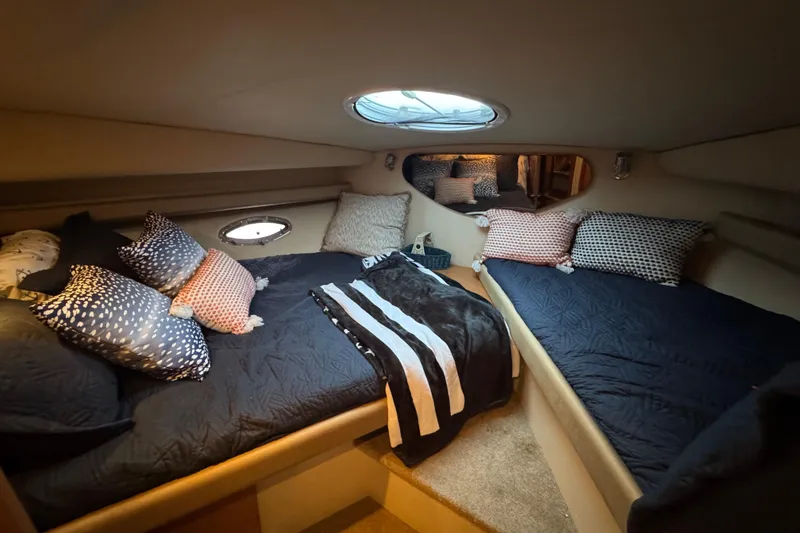 Slide: The Image of Luxurious 2008 Cruisers Yachts 395 Motoryacht cabin with cozy bedding and elegant decor. - 30