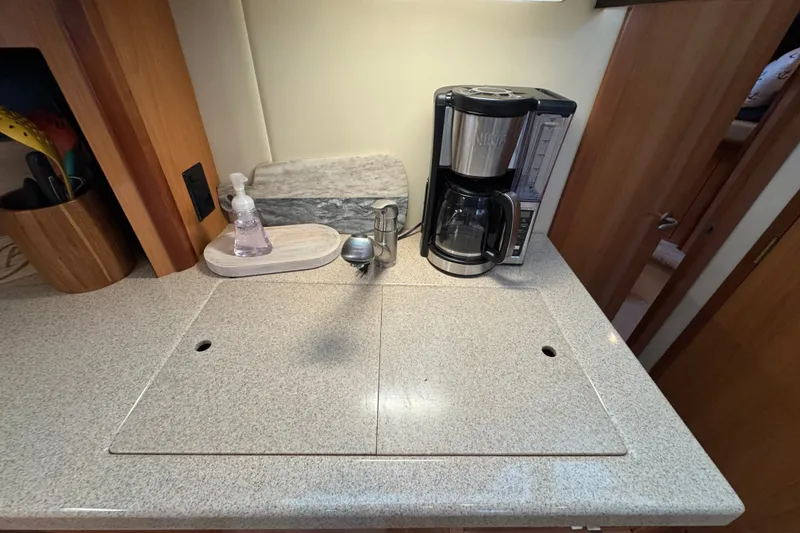 Slide: The Image of Kitchen area in 2008 Cruisers Yachts 395 Motoryacht with coffee maker and soap dispenser. - 41
