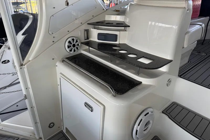 Slide: The Image of 2008 Cruisers Yachts 395 Motoryacht interior with sleek black countertops and modern amenities. - 21