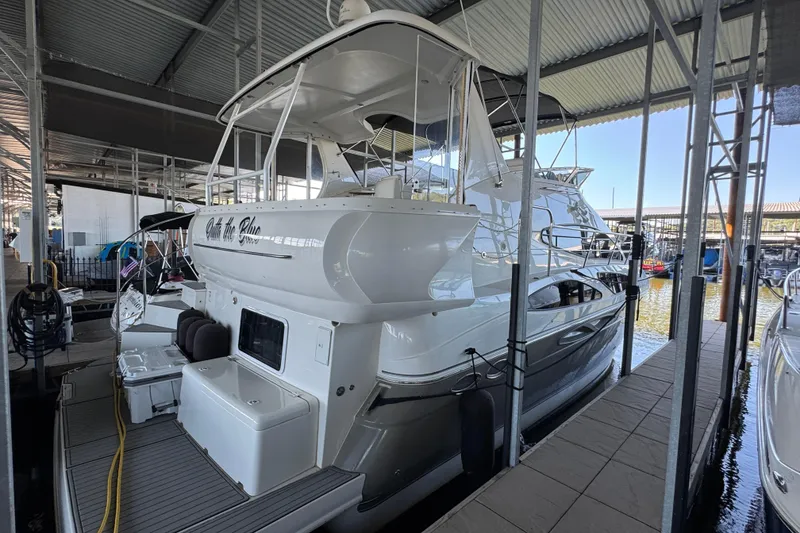 Slide: The Image of 2008 Cruisers Yachts 395 Motoryacht docked in a covered marina. - 14