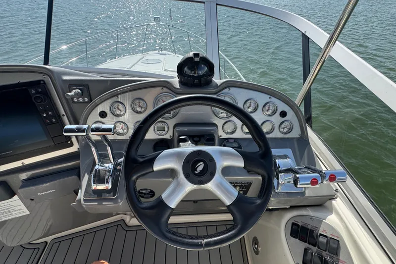 Slide: The Image of Helm of 2008 Cruisers Yachts 395 Motoryacht with steering wheel and control panel. - 25