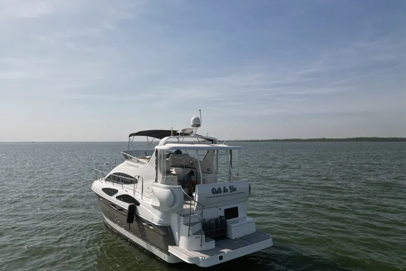 Slide: The Image of 2008 Cruisers Yachts 395 Motoryacht on open water under clear sky. - 3