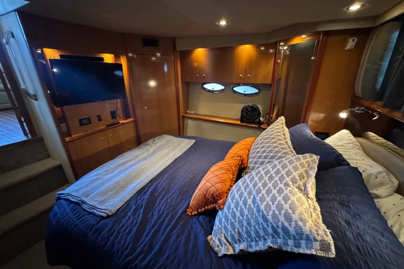 Slide: The Image of Luxurious 2008 Cruisers Yachts 395 Motoryacht bedroom with cozy bedding and modern amenities. - 57