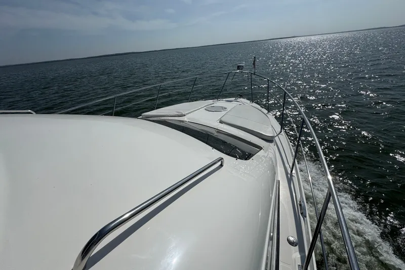 Slide: The Image of 2008 Cruisers Yachts 395 Motoryacht cruising on open water under clear skies. - 4