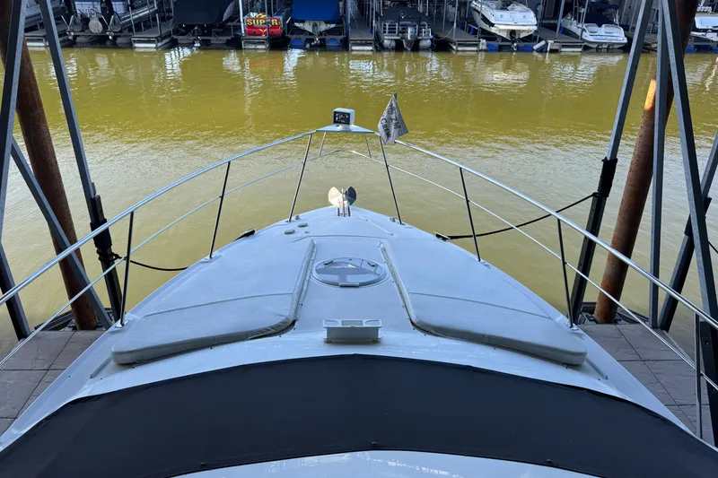 Slide: The Image of 2008 Cruisers Yachts 395 Motoryacht docked at marina, viewed from bow. - 8